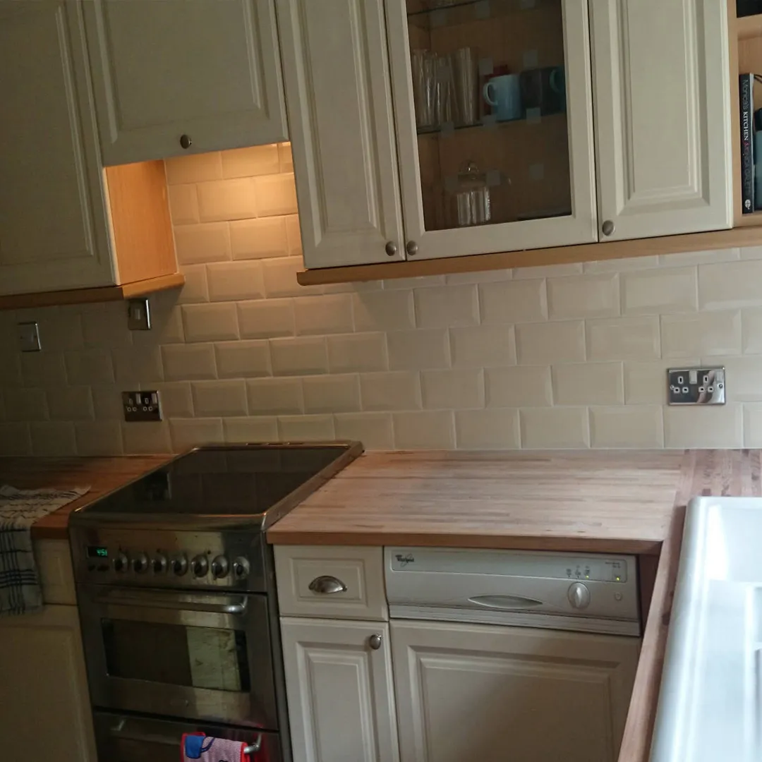 cream  kitchen with real wood bench top and country sink