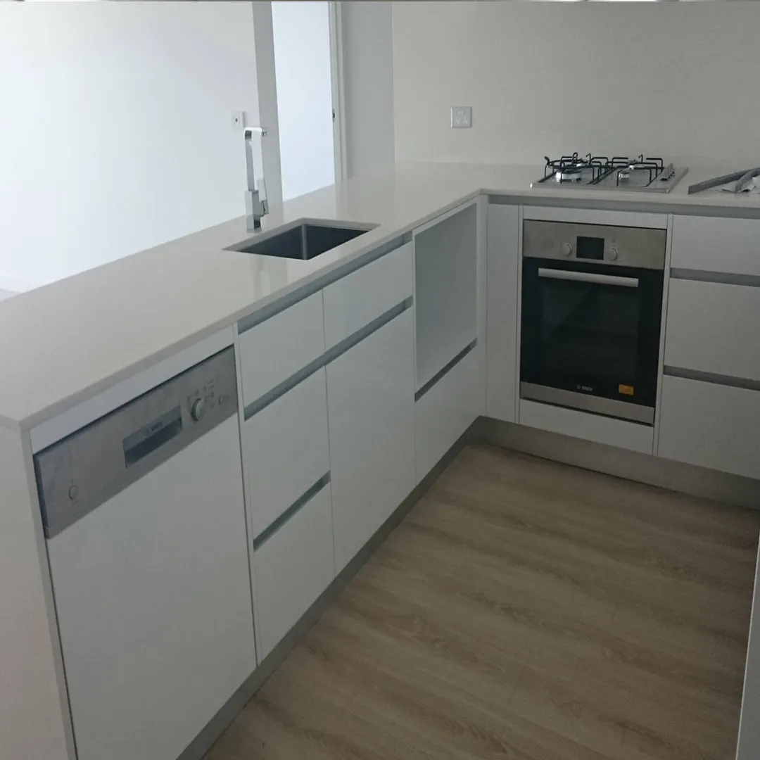 modern handleless kitchen with ceaserstone benchtop